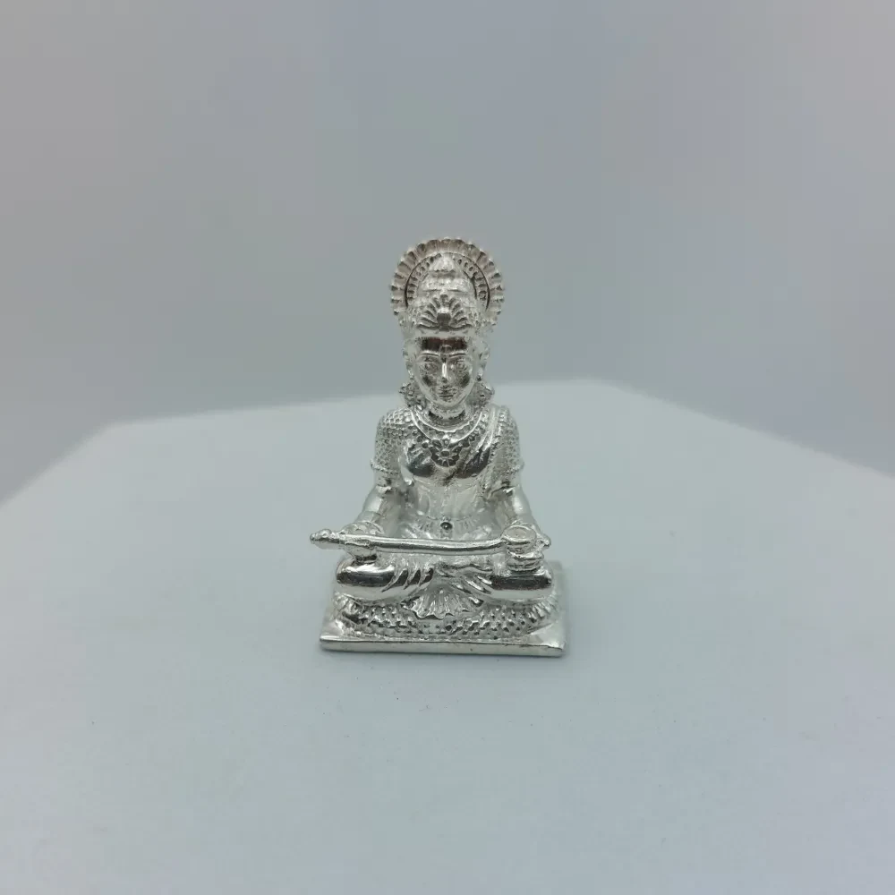 Bring a sense of divine grace to your sacred space with this beautifully crafted Annapurna Maa Silver Murti, made in 925 Sterling Silver and designed as a solid silver murti. The idol beautifully depicts Maa Annapurna seated gracefully in a traditional posture, holding a finely detailed ladle and vessel, symbolizing nourishment and abundance. Intricate detailing on her crown, jewellery, attire, facial features, and the richly patterned pedestal showcases exquisite Indian craftsmanship. The polished silver finish enhances its elegant appearance and f